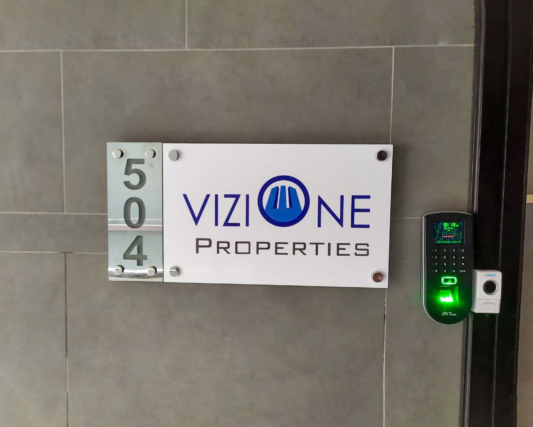 Vizione Properties acrylic door signage with unit number